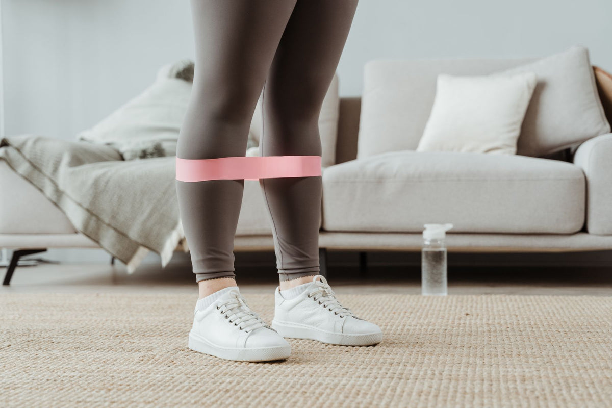 Close-up of a resistance band during a leg exercise at home